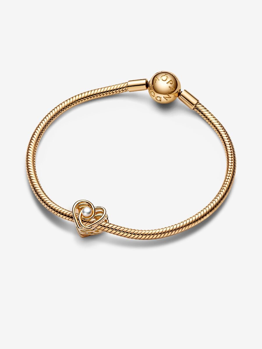 Charm Cœur tourbillonnant ajouré et perle de culture d’eau douce traitée