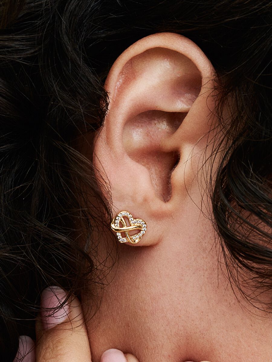 Clous d’oreille scintillants avec cœur et symbole d’infini