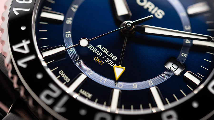 Aquis GMT Date