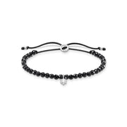Bracelet perles noires avec pierre blanche
