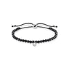 Bracelet perles noires avec pierre blanche