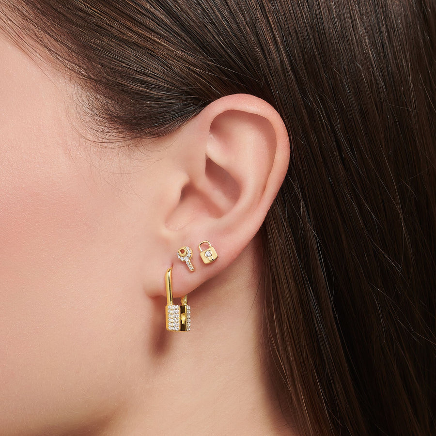 Clou d'oreille unique clé pierres blanches or
