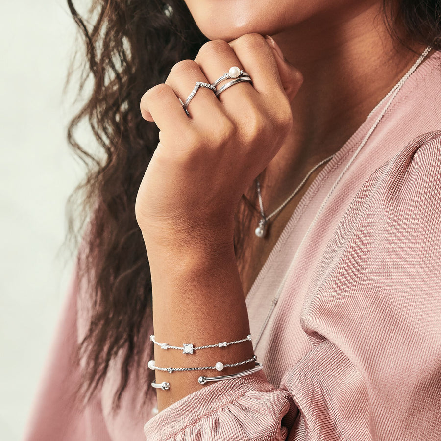Bague forme en V avec pierres blanches argent