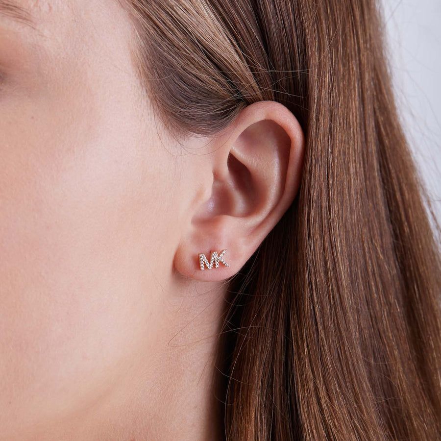 MK Boucles d'oreille logo